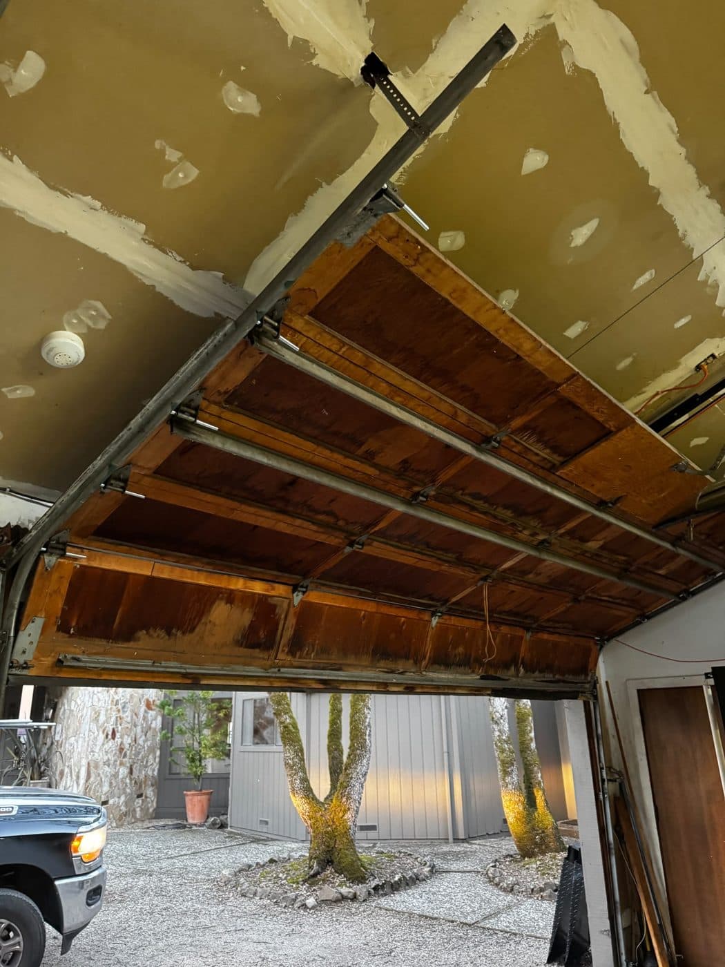 Off-track wood door, put back on track — after